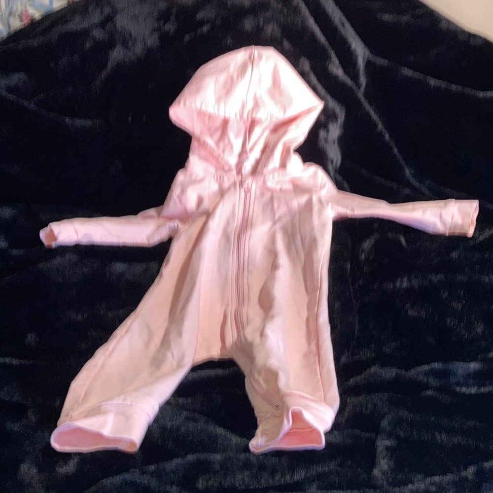 Pink onesie grey dragon look on the back
